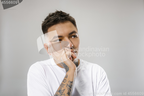 Image of Beautiful bored man bored isolated on gray background