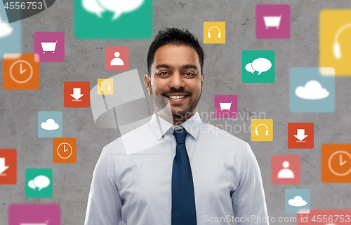 Image of indian businessman over app icons