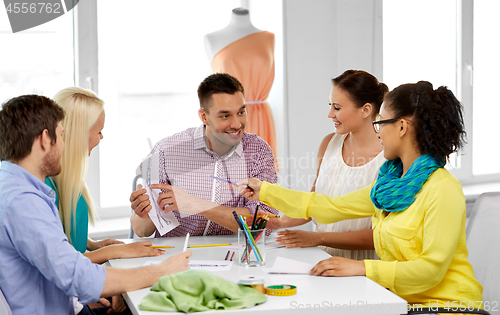 Image of team of fashion designers working at office