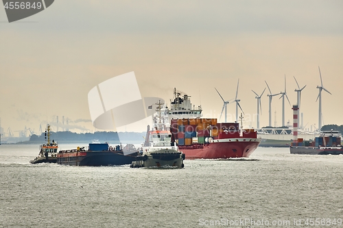 Image of Ship carrying containers through Rotterdam