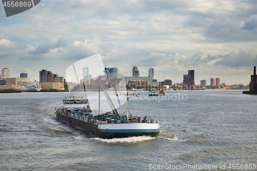 Image of Ship transporting cargo through Rotterdam