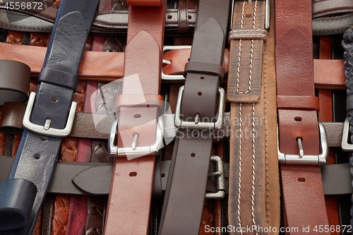 Image of Leather belts at a market