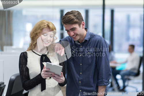 Image of Business People Working With Tablet in startup office