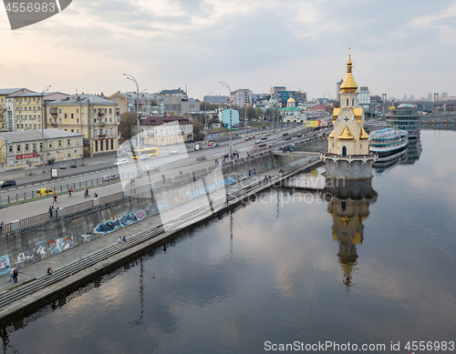 Image of Church of Saint Nicholas on the water, old embankment and Havanskyi Bridge in Kiev, Ukraine.