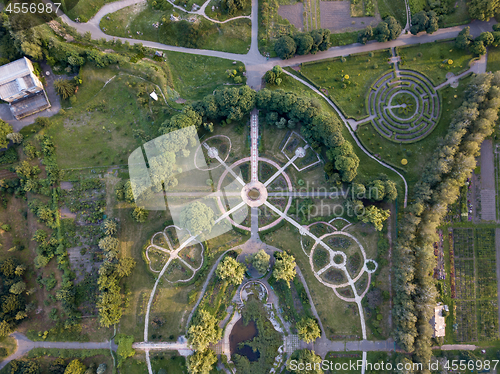 Image of Regular and landscape planning of the garden with alleys, flowerbeds, labyrinth and squares. The aerial view from the drone is strictly from above.