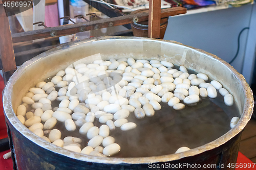 Image of Boiling silkworm cocoon in a pan with water. A process of making silk cloth in Istanbul