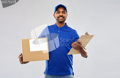 Image of indian delivery man with parcel box and clipboard