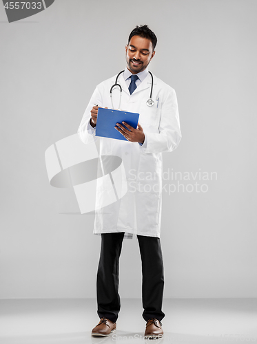 Image of indian male doctor with clipboard and stethoscope