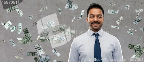 Image of indian businessman over money rain