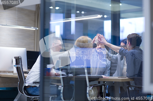 Image of startup Group of young business people celebrating success