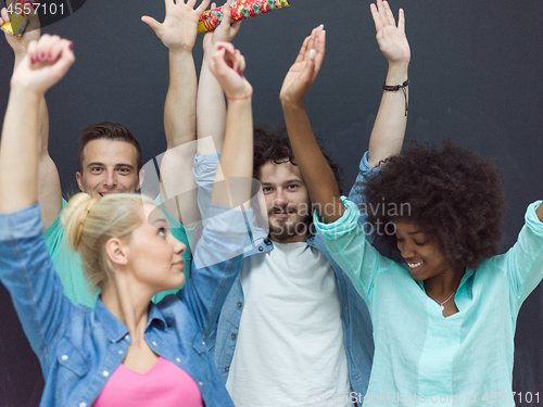 Image of confetti party multiethnic group of people isolated over gray