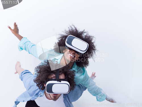 Image of multiethnic couple getting experience using VR headset glasses