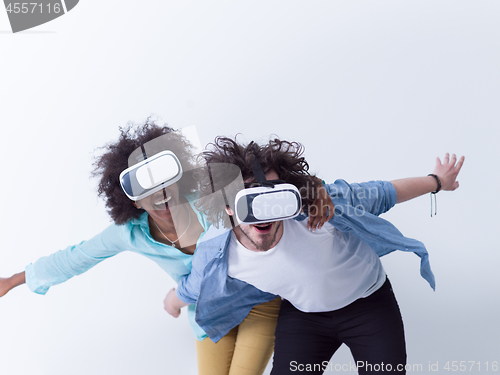 Image of multiethnic couple getting experience using VR headset glasses