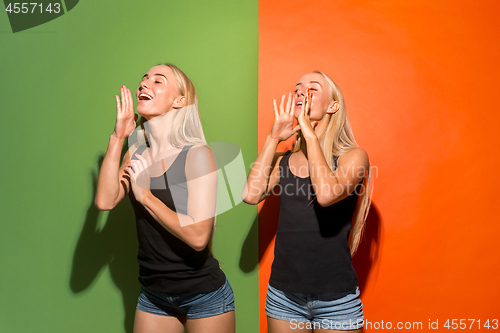 Image of The young casual women shouting at studio