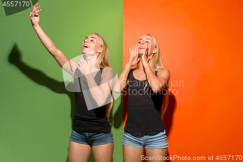 Image of The young casual women shouting at studio