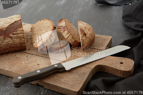 Image of Fresh bread on wooden board