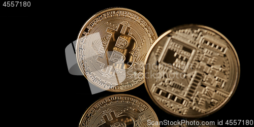 Image of bitcoin gold coin isolated on black background