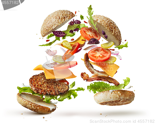 Image of burger with flying ingredients