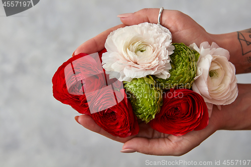 Image of girl holding a bouquet of flowers