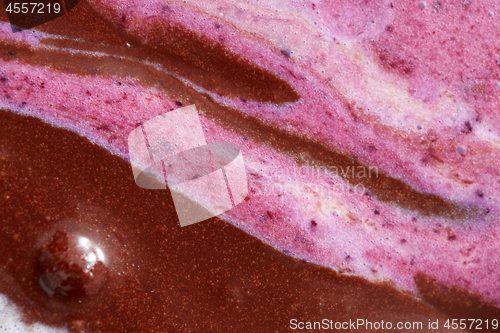 Image of Abstractive structure of a mix colorful melted chocolate-berries ice cream close-up.