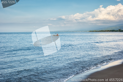 Image of a dark sand beach in northern Bali Indonesia