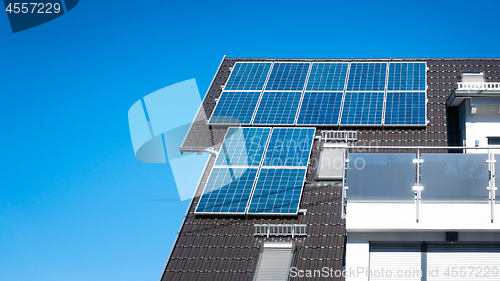 Image of some solar panels on the roof of a private house