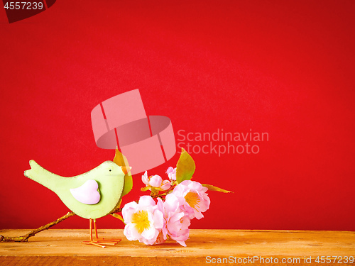 Image of bird with a branch of blossoms easter holiday decoration backgro