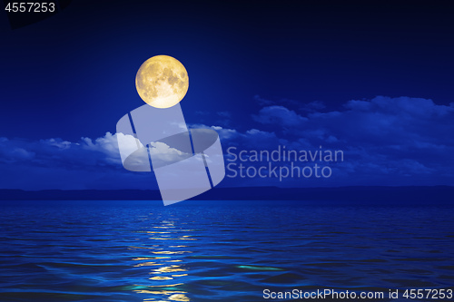 Image of wide ocean waves horizon moon night background