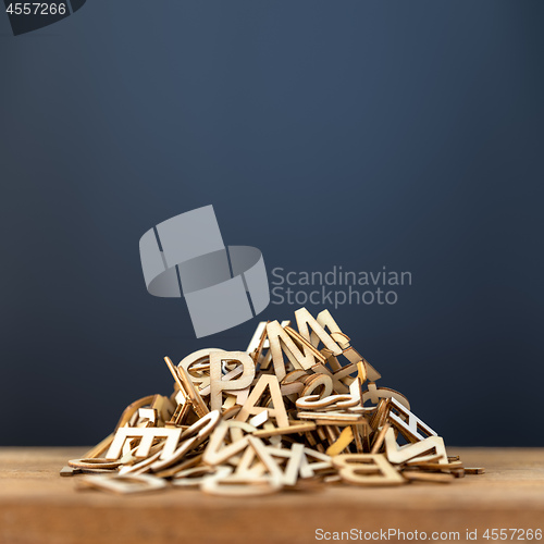 Image of pile of wooden letters background