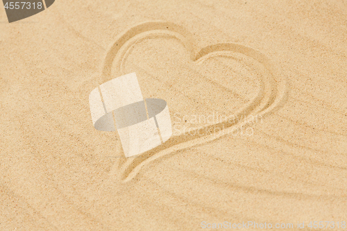 Image of picture of heart in sand on summer beach