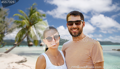 Image of happy couple in sunglasses outdoors in summer