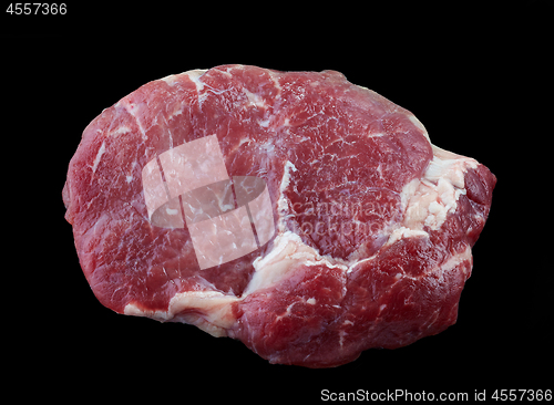 Image of fresh raw steak meat on black background