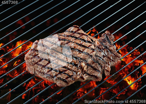Image of beef steak meat on grill