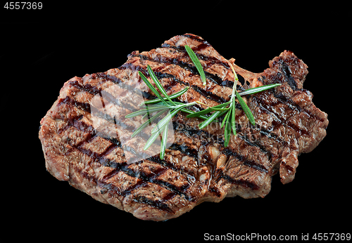 Image of grilled beef steak meat on black background