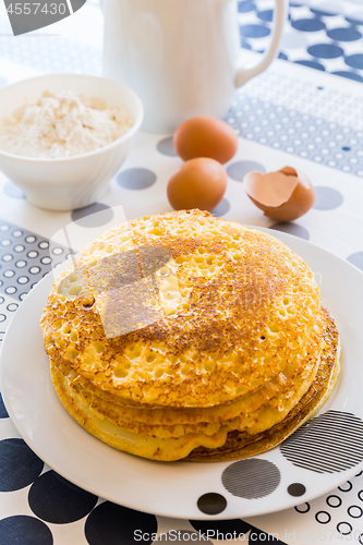 Image of Stack of pancakes with baking ingredients