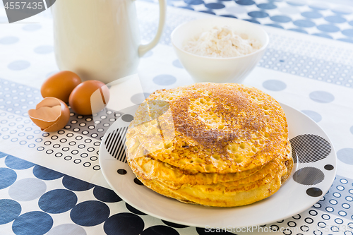 Image of Stack of pancakes with baking ingredients