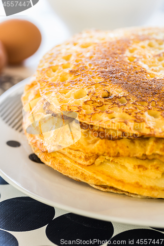 Image of Stack of pancakes with baking ingredients