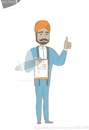 Image of Hindu businessman with clipboard giving thumb up.