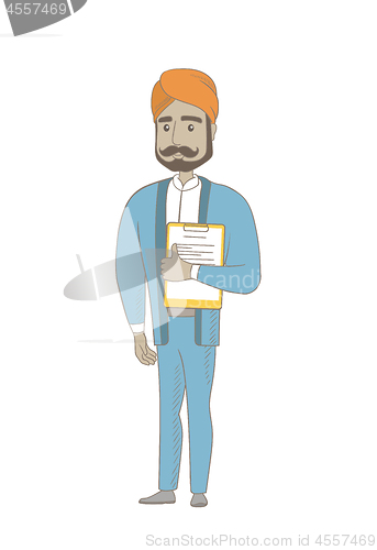 Image of Hindu businessman holding clipboard with documents