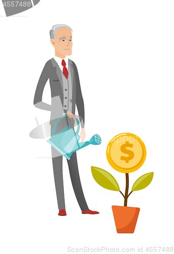 Image of Senior caucasian businessman watering money flower