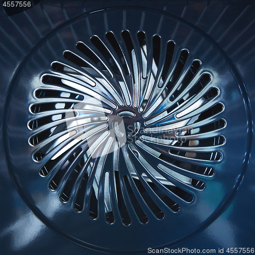 Image of Close-up of metal fan. Inside the furnace