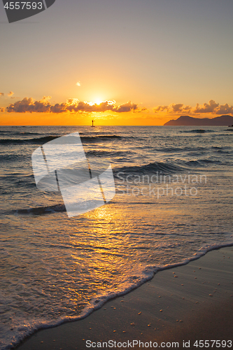 Image of Brilliant ocean beach sunrise.