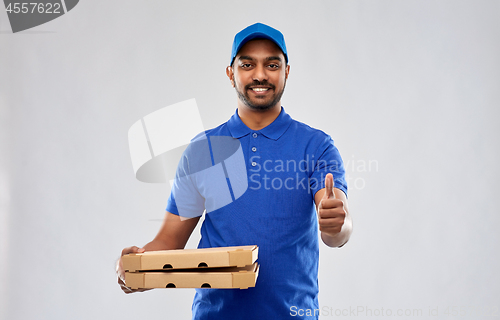 Image of indian delivery man with pizza showing thumbs up