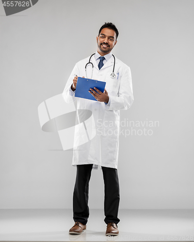 Image of indian male doctor with clipboard and stethoscope