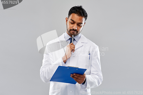 Image of indian male doctor or scientist with clipboard