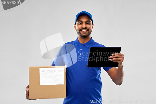 Image of indian delivery man with tablet pc and parcel box