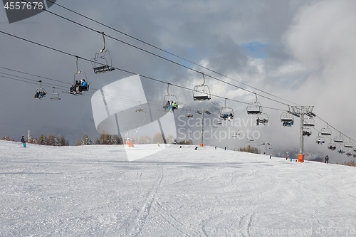 Image of Skiing slopes, with many people