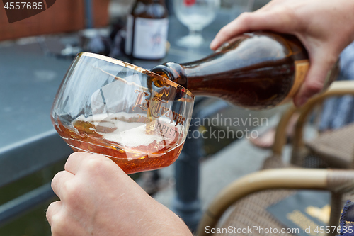 Image of Trappist beer poured in a glass in The Netherlands