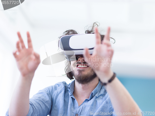 Image of man using VR-headset glasses of virtual reality