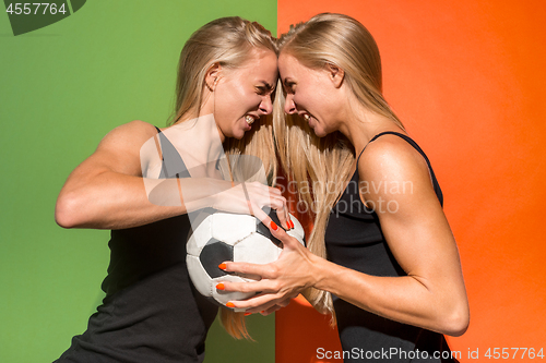 Image of Fan sport woman player holding soccer ball